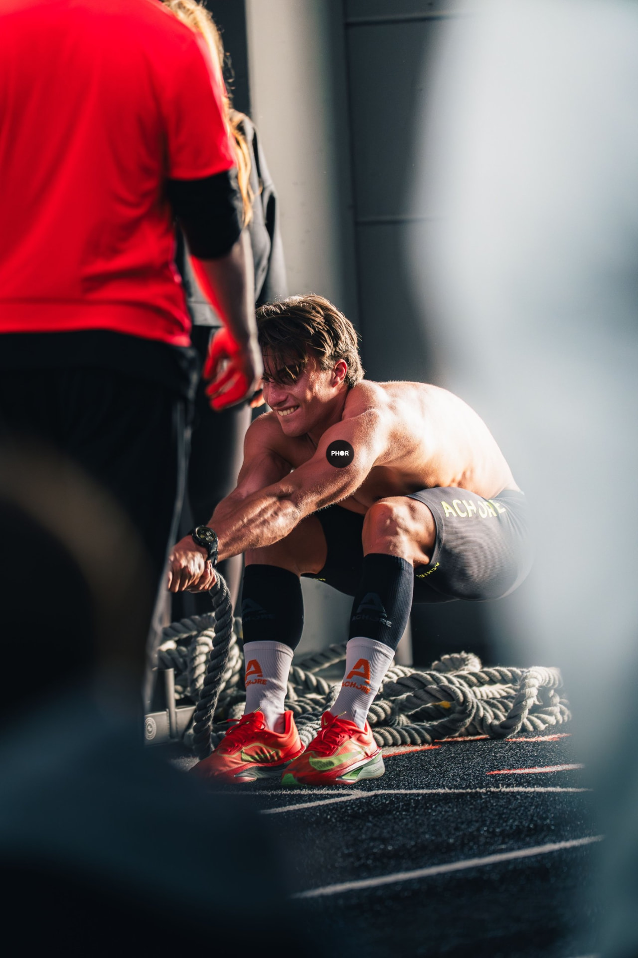 Athlete wearing the PHOR patch at the gym